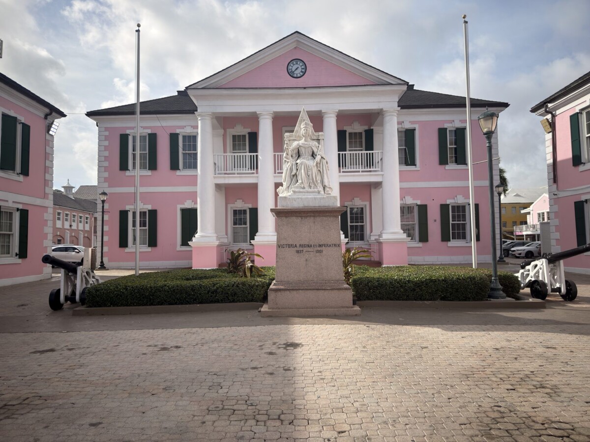 Pink colonial Parliament building and Queen Victoria statue at Parliament Square in downtown Nassau