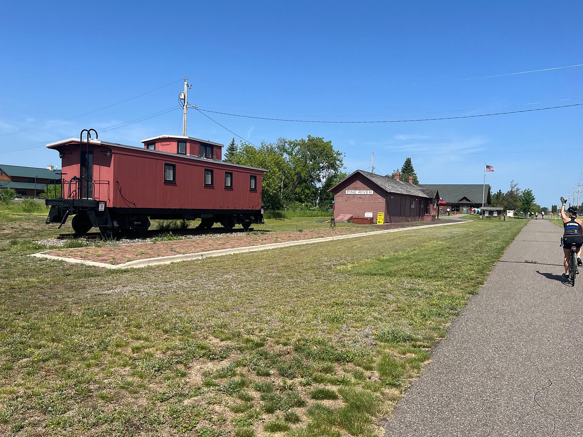 Biker and scenery in Paul Bunyan State Trail