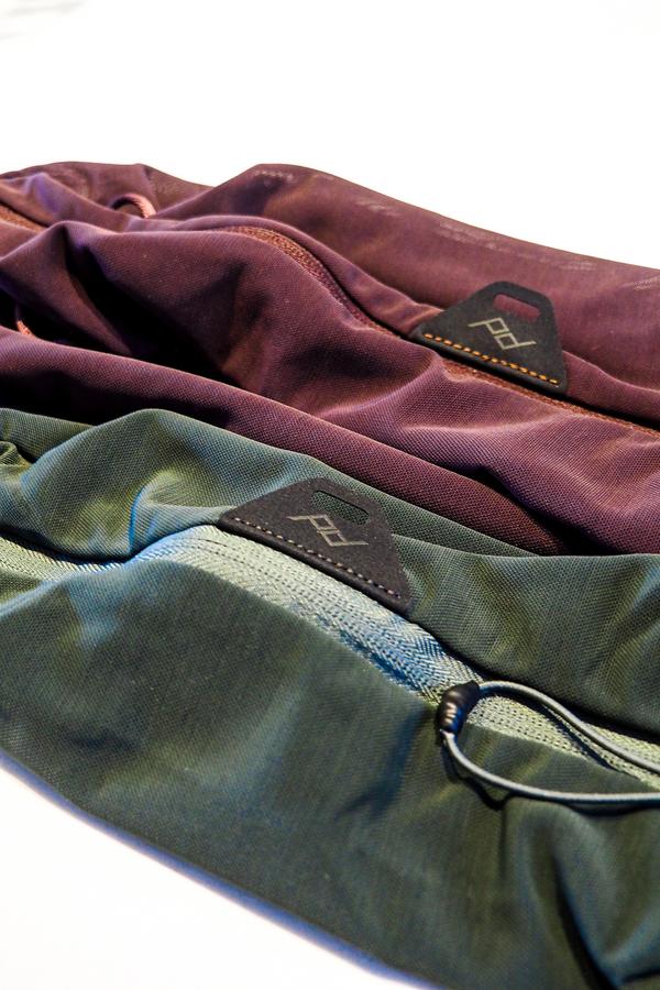 Peak Design Packing Cubes in sage and red for organized travel packing