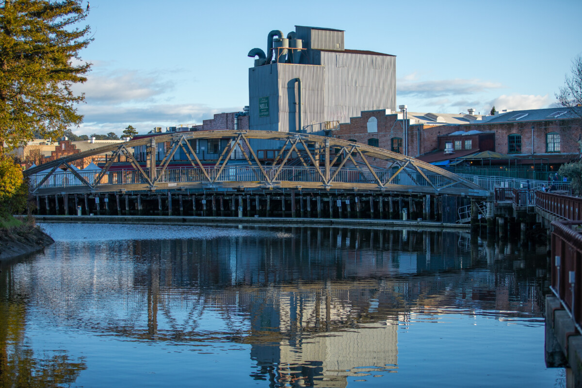 Bridge and building establishments by the river in Petaluma, California