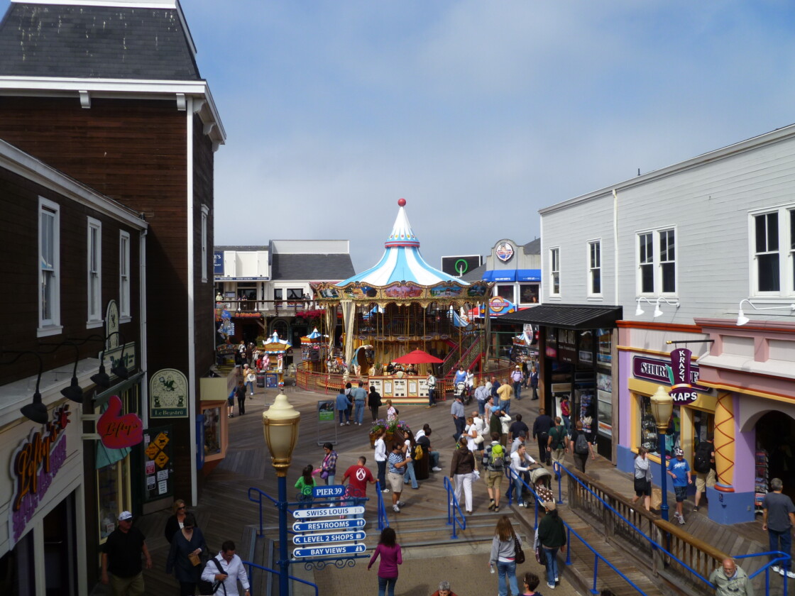 People walking around pier 39's carousel in San Francisco