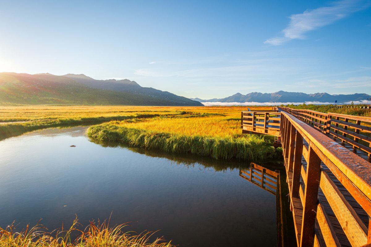 Panoramic view and wooden boardwalk at Potter Marsh Bird Sanctuary in Anchorage, Alaska