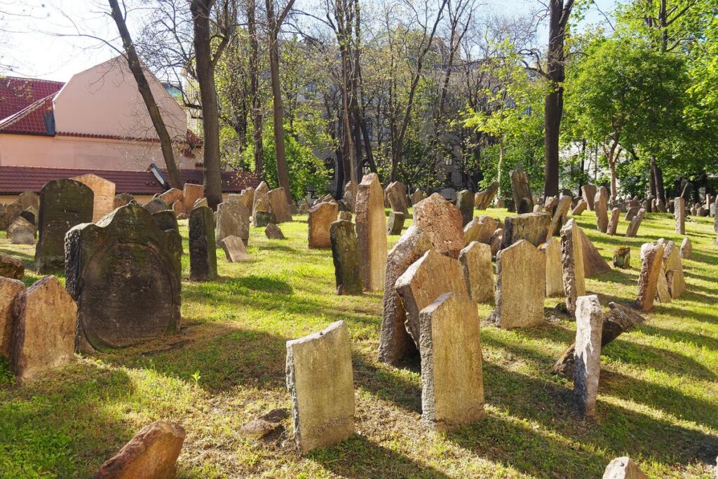 Ancient Jewish gravestones in the lush Old Jewish Cemetery, Prague