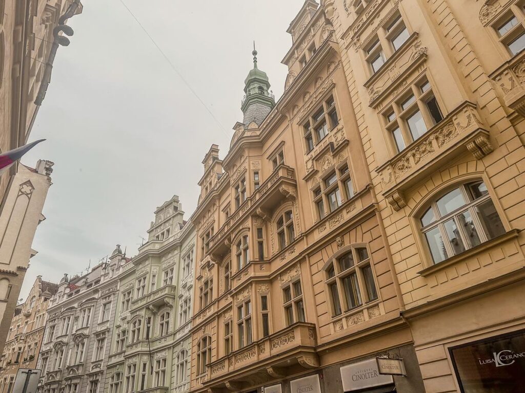 A photograph of historical architecture in Prague's Jewish Quarter, capturing the romantic essence of Prague.