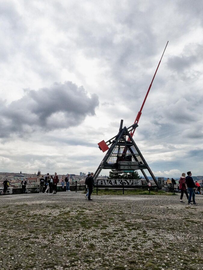Iconic Prague Metronome Monument against a cloudy sky