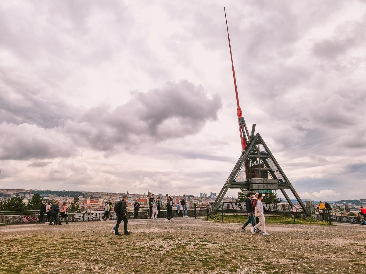 Prague Metronome with tourists against cityscape