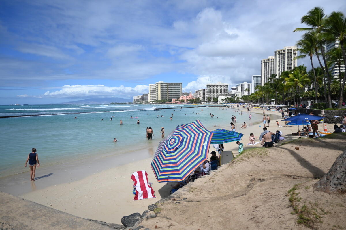 People relaxing at Prince Kuhio Beach Park