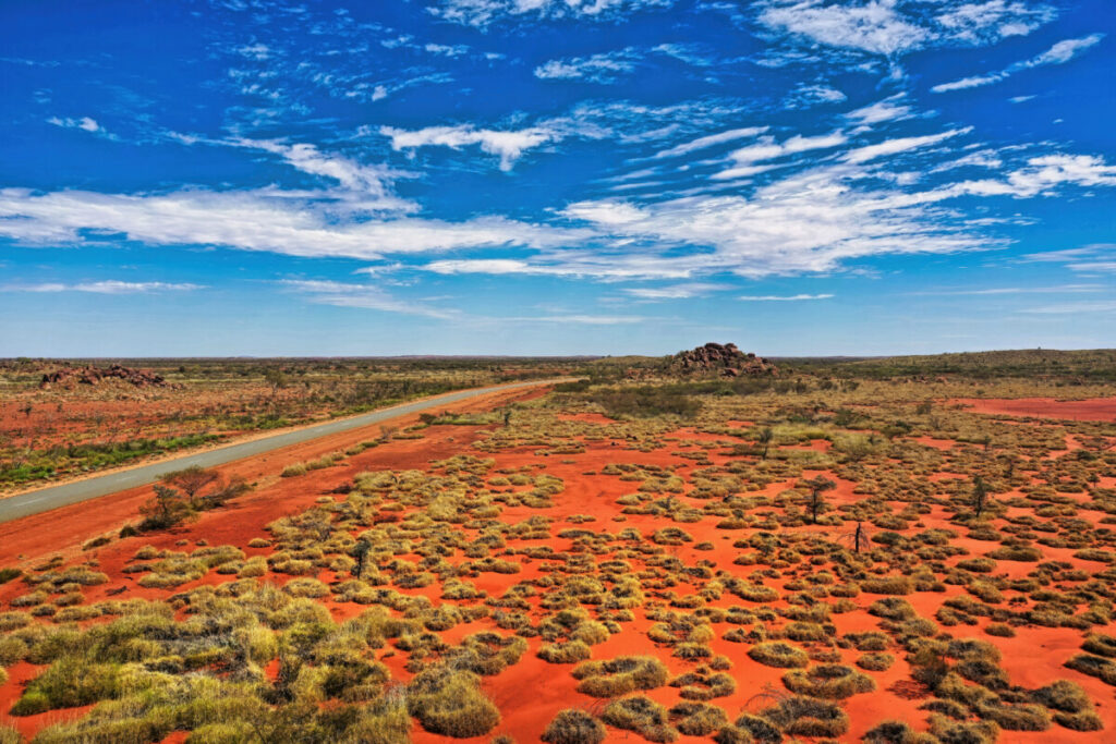 Aerial view of the road and scenery of the Red Centre, Australia