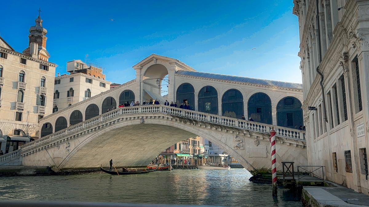 Rialto Bridge over Grand Canal in Venice, iconic architectural landmark and romantic travel destination