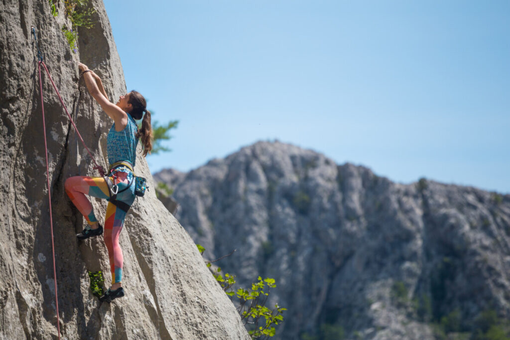 Woman rock climbing in Paklenica National Park