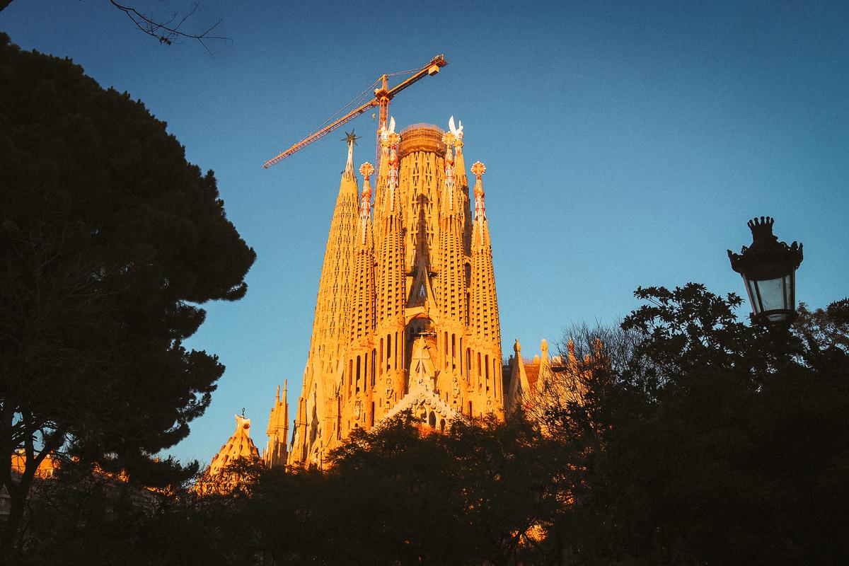 Sunset view of La Sagrada Familia against Barcelona's skyline