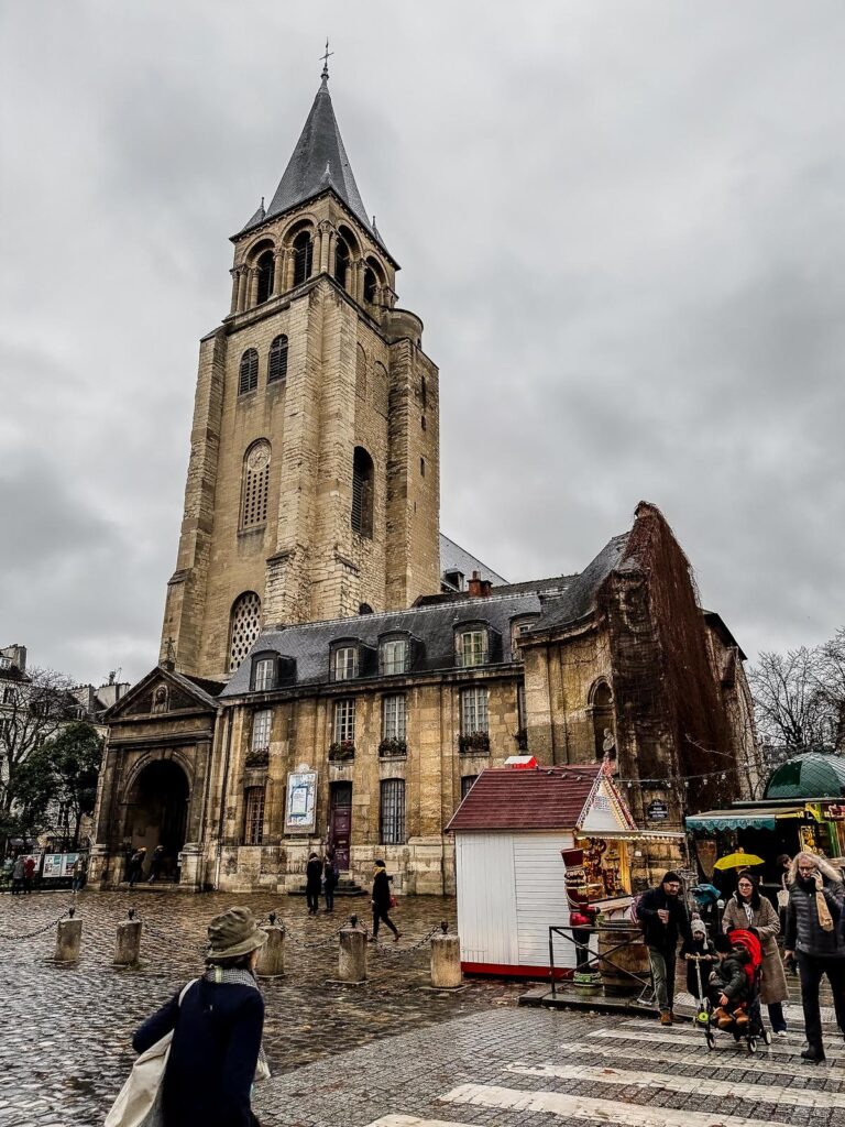Saint-Germain-des-Prés church, Paris, medieval architecture with visitors.