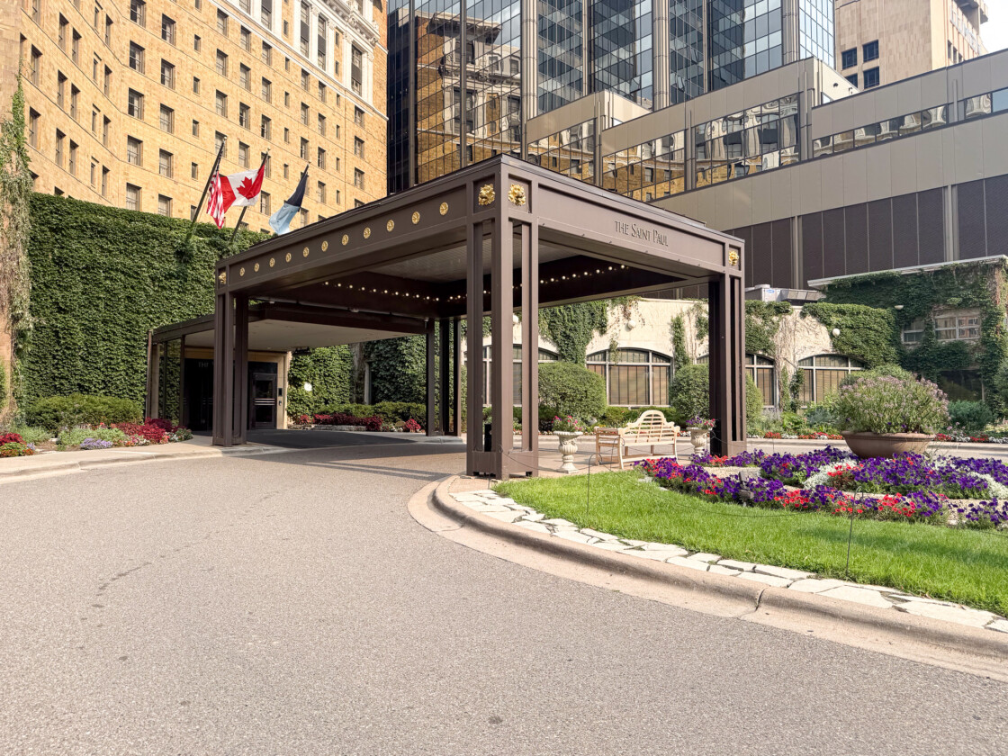 Saint Paul Hotel entrance with ivy-covered facade and gardens in Saint Paul, Minnesota.