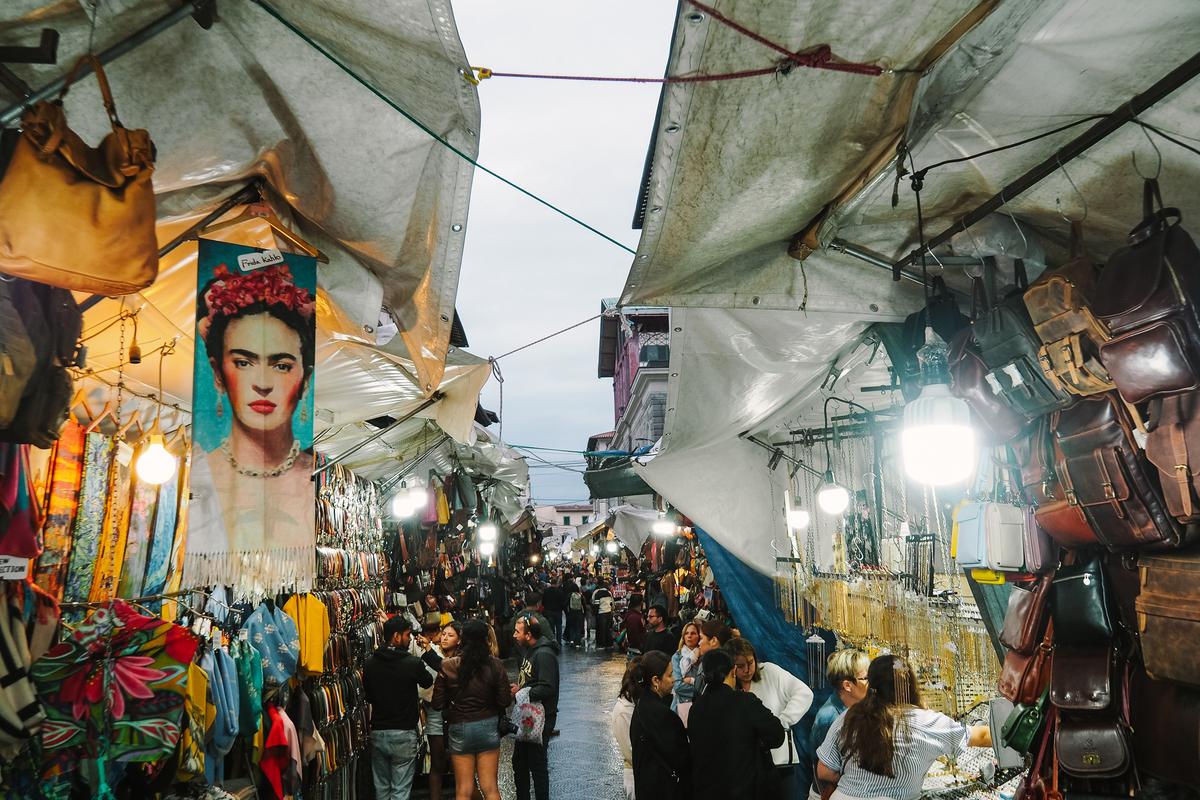 Lively San Lorenzo Market Florence with colorful stalls and Italian leather goods