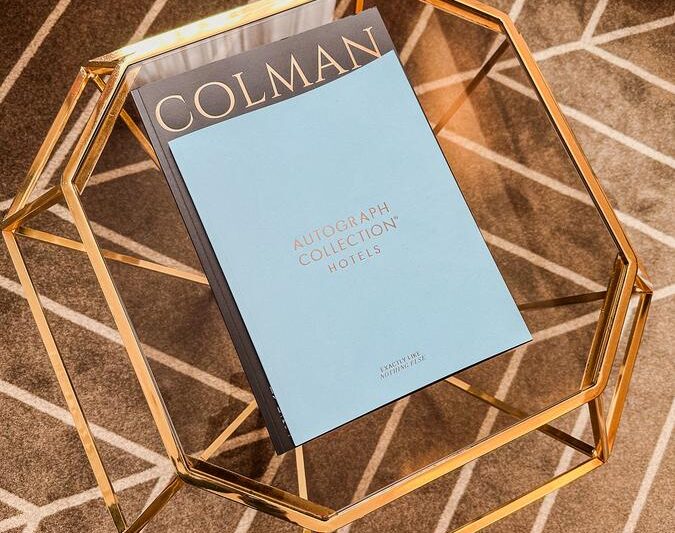 Elegant coffee table with Colman book in Sapphire House Antwerp room