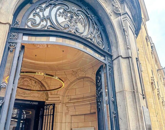 Elegant entrance of Sapphire House Hotel featuring ornate ironwork and classical architecture