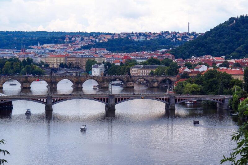 Scenic View of Vltava River and Historic Bridges, Prague - Serene river scene with iconic bridges and cityscape
