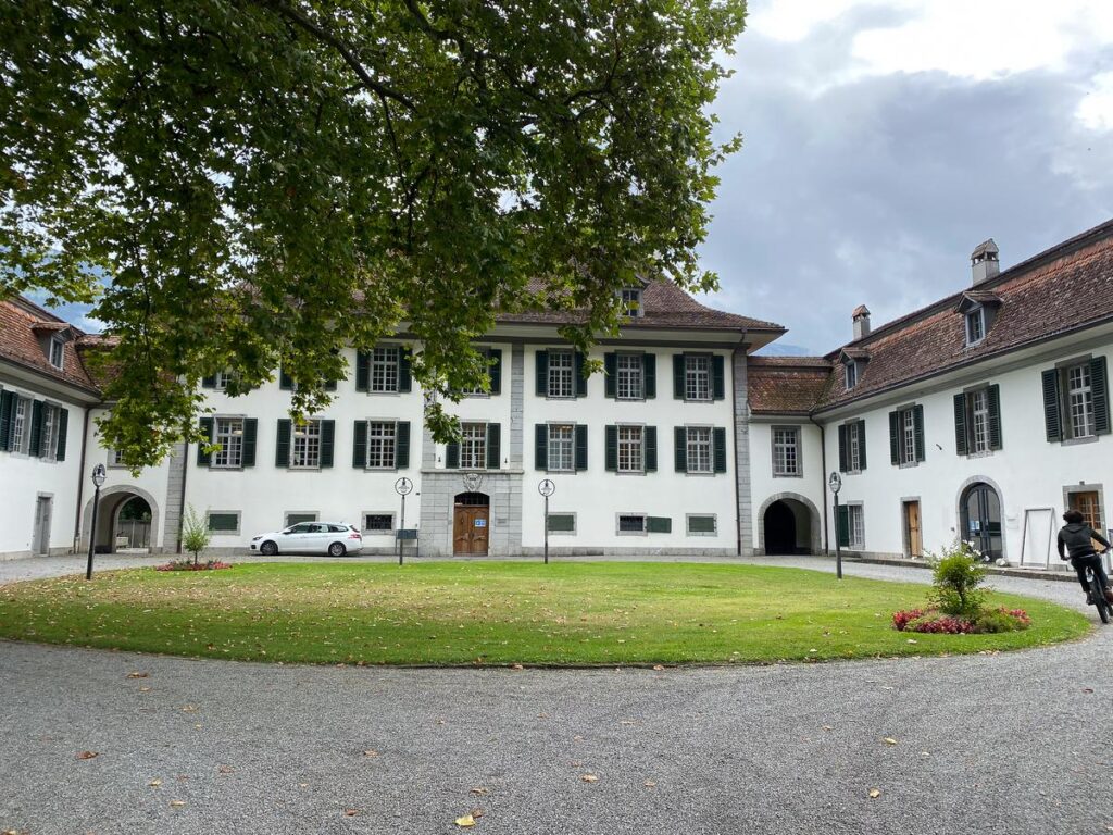 Schloss Interlaken: Historic Swiss Monastery Against Cloudy Sky