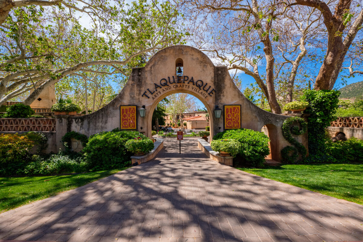 Tlaquepaque Arts and Crafts Village entrance in Sedona, Arizona with adobe-style architecture.