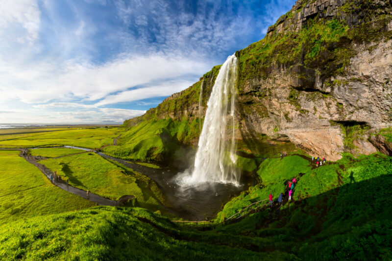 Hikers visiting Seljalandsfoss Waterfall, Iceland