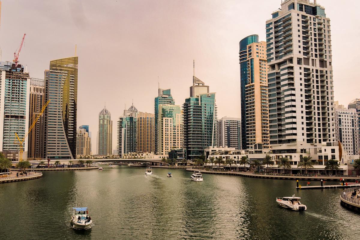Alt text: Dubai Marina skyline with boats in sRGB.