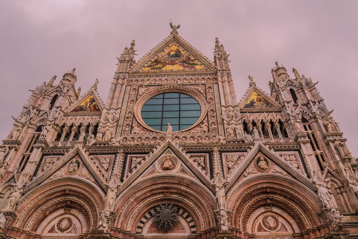 Siena Cathedral Gothic façade at dusk in Tuscany