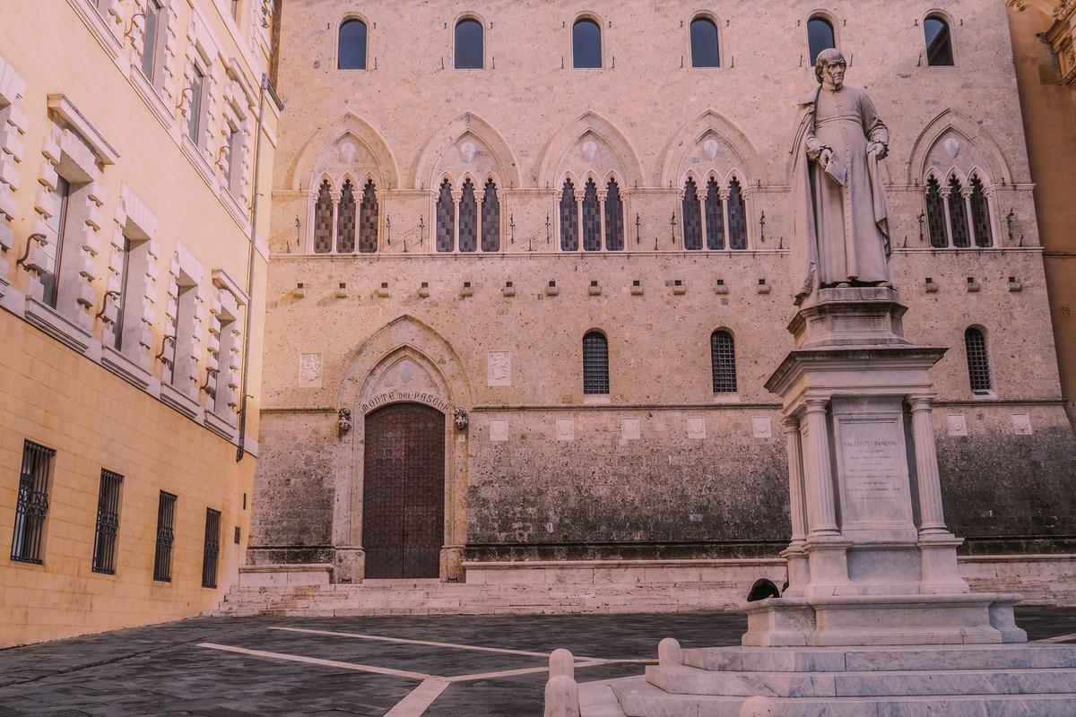 Medieval statue and architecture in Siena Italy under a clear sky