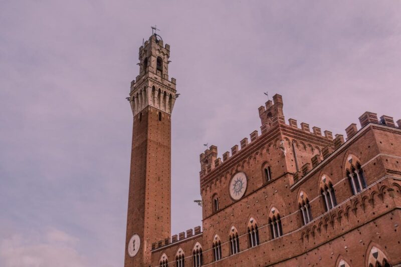 Torre del Mangia and Palazzo Pubblico in Siena at dusk