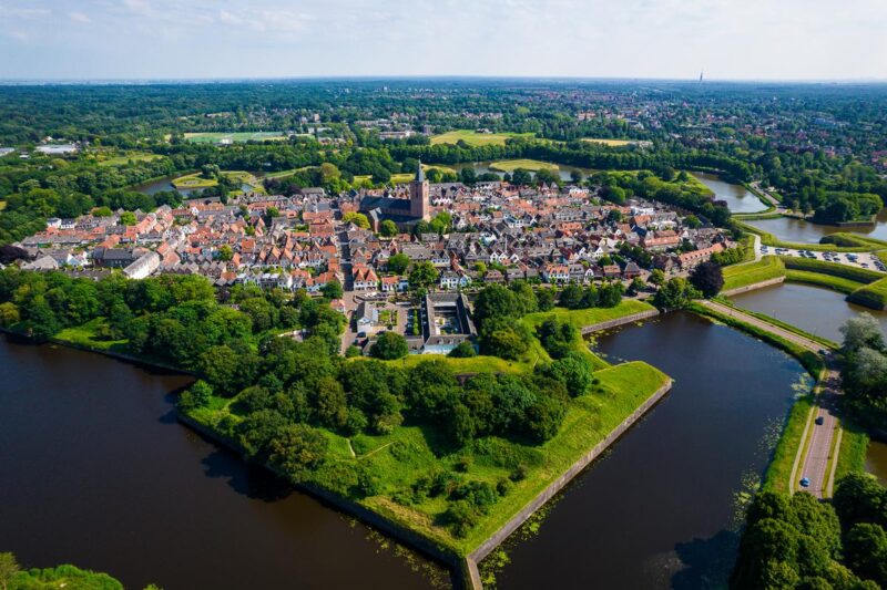 Aerial view of star fort Naarden, Netherlands, surrounded by greenery and waterways