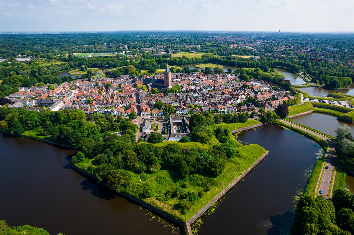 Aerial view of star fort Naarden, Netherlands, surrounded by greenery and waterways