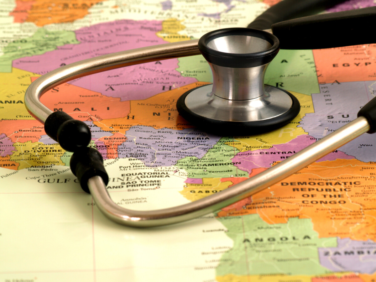 Stethoscope on top of  world map