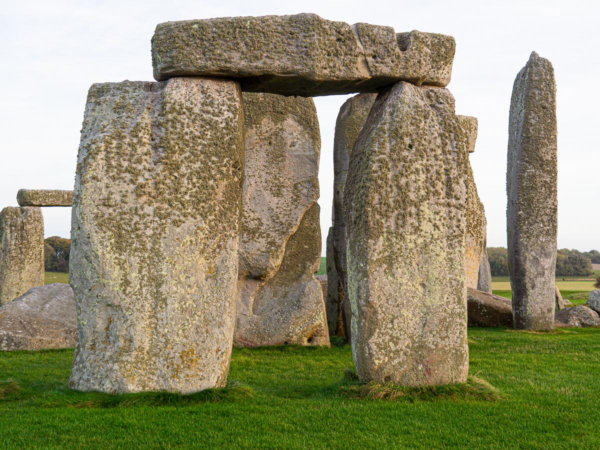 Close-up view of Stonehenge's ancient megaliths against serene sky