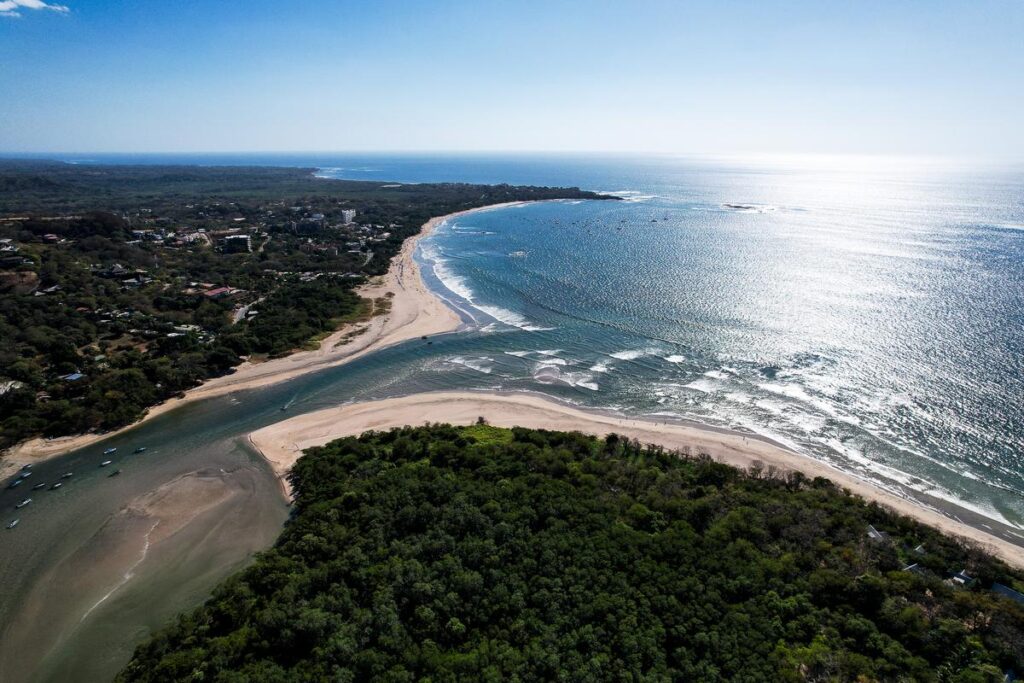 Aerial view of Tamarindo Estuary, Costa Rica - Serene beauty of mangrove forests and coastline