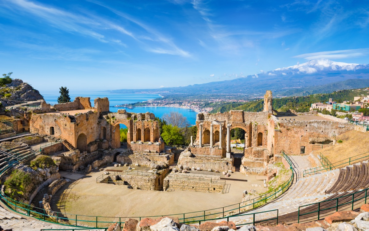 Ancient Greek Theatre in Taormina with Mount Etna in the background