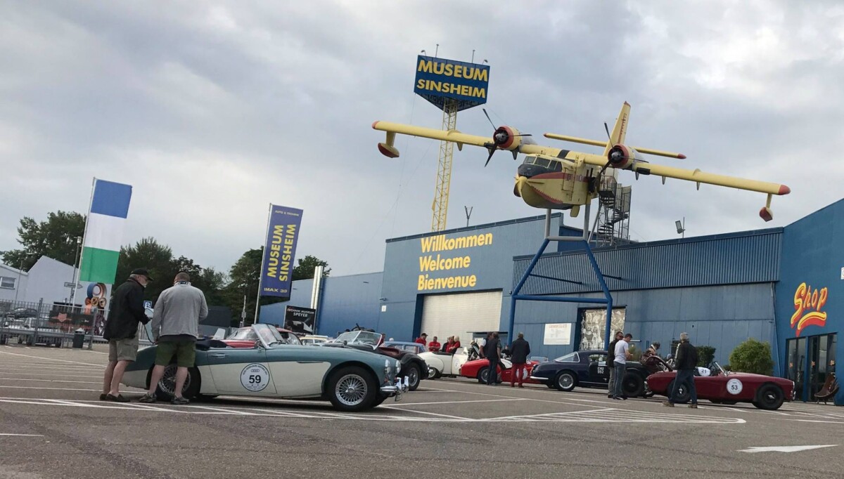 Different vehicles and front of the Technik Museum Sinsheim in Sinsheim, Germany