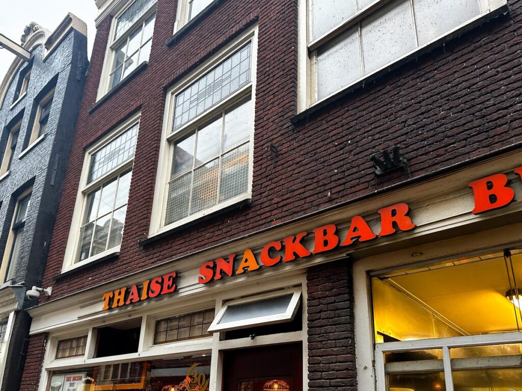 Authentic Thai Snackbar in Amsterdam with vibrant orange signage