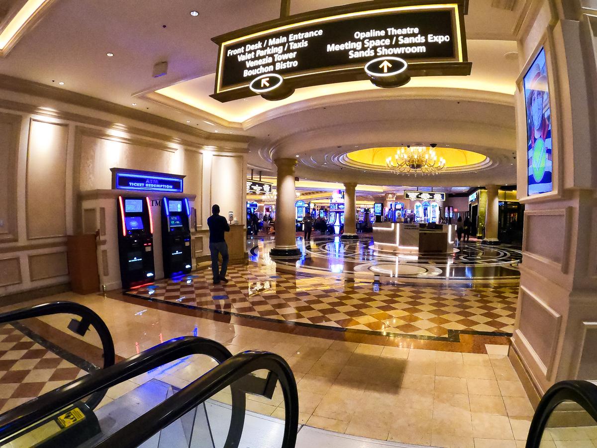 Spacious casino floor at The Venetian Las Vegas showcasing slot machines and elegant architecture