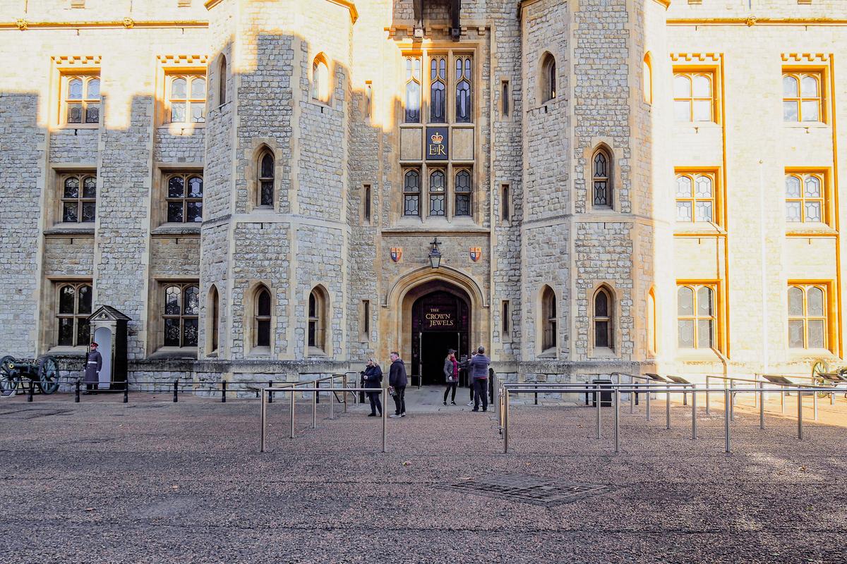 Entrance to Crown Jewels exhibition at Tower of London against a blue sky