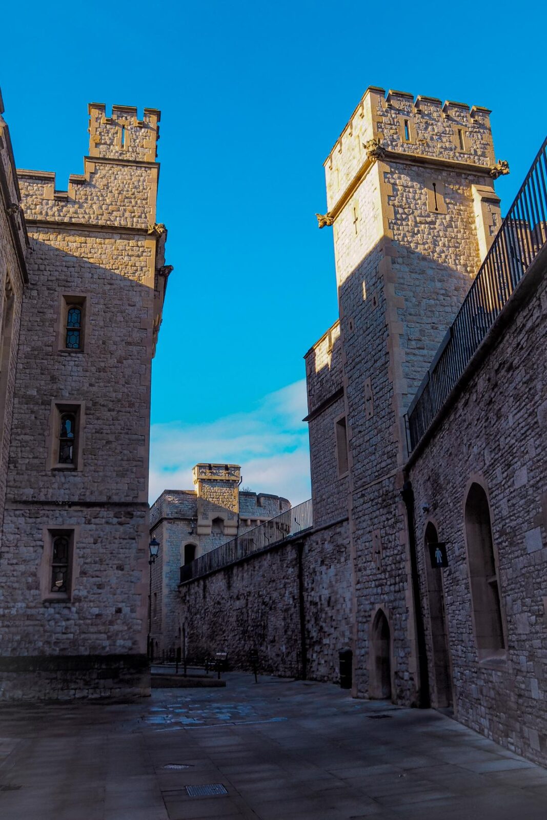 Tower of London historic walls and towers under clear blue sky