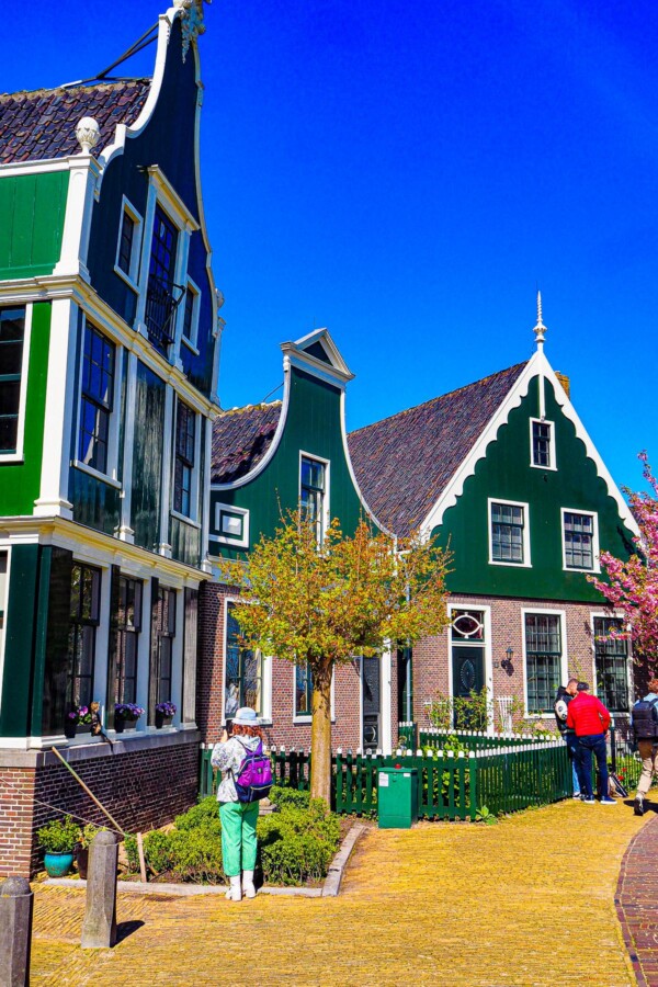 Traditional Dutch architecture at Zaanse Schans, Netherlands - Historic charm, green and white facades, gable roofs, cultural travel.