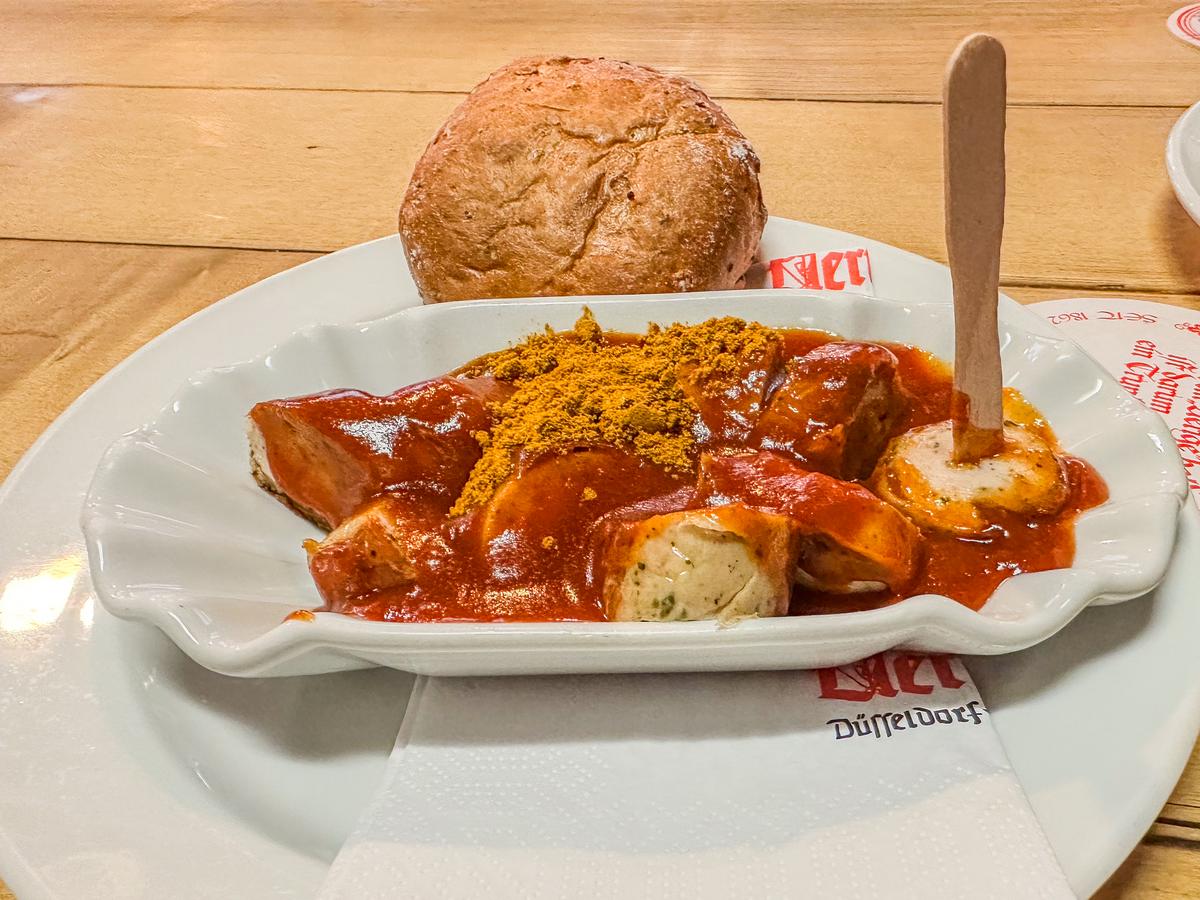 Traditional German currywurst and bread roll in Düsseldorf (source: [AIOSEO](https://aioseo.com/how-to-write-alt-text-for-images-for-seo-3-easy-tips/))