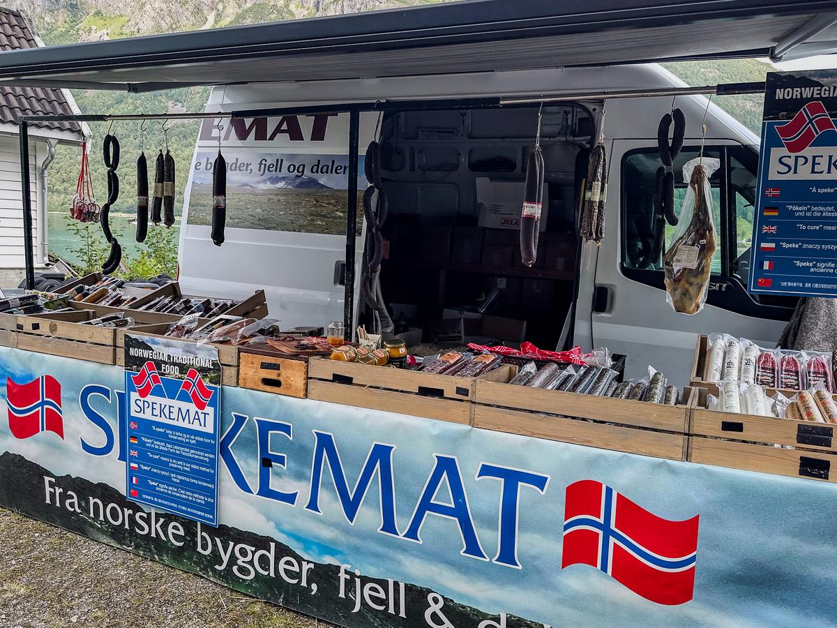 traditional Norwegian sausage stand at local market offering authentic cured meats (spekemat)