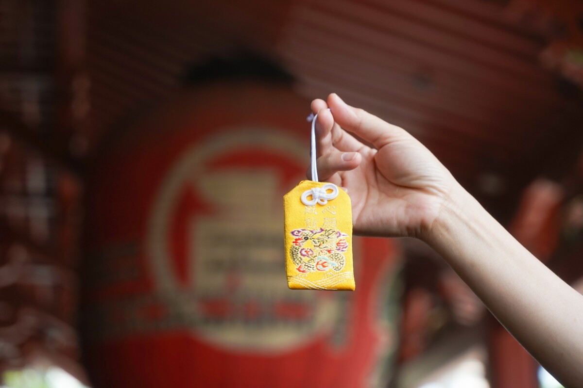 Hand holding a Traditional Omamori