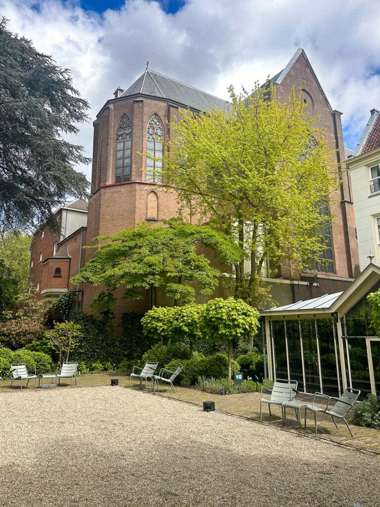 Tranquil Oasis at Pulitzer Hotel Amsterdam - Historic charm and modern elegance in serene interior courtyard.