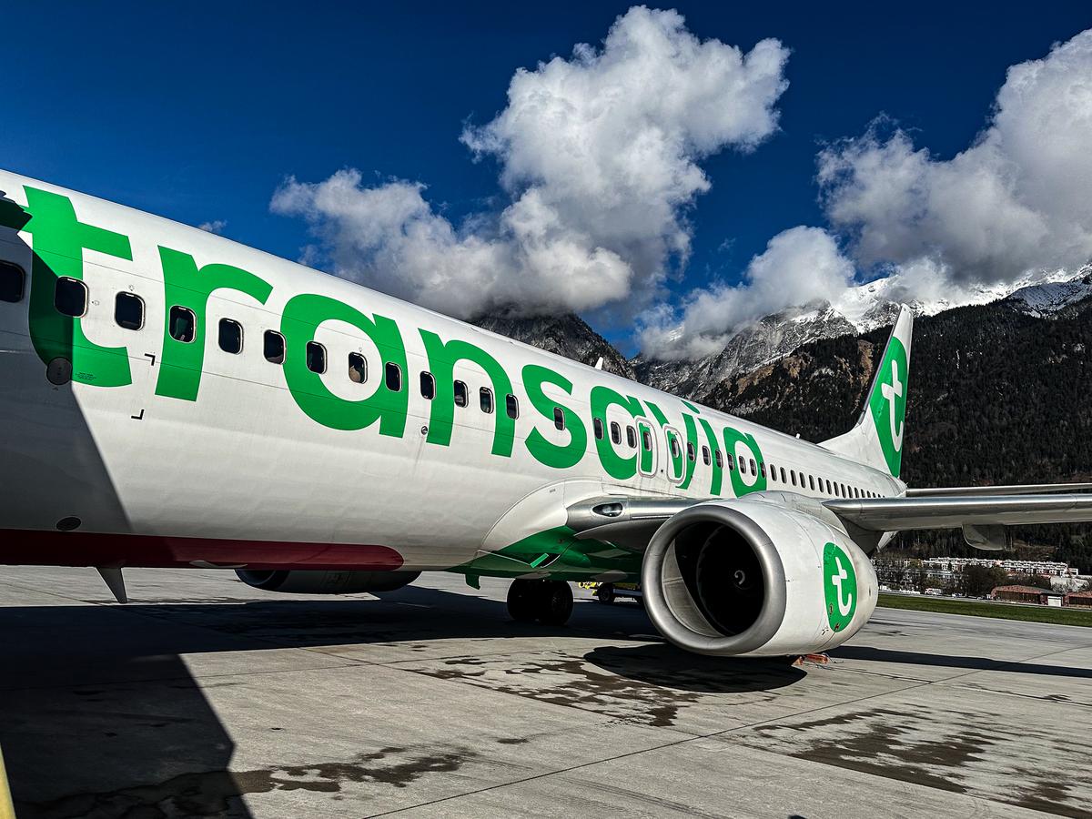 Transavia airplane departure at Innsbruck Airport with Austrian Alps backdrop