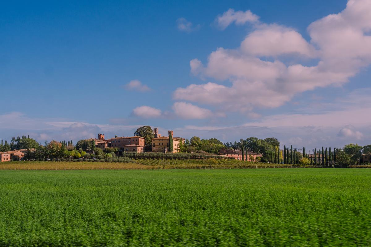 Serene Tuscan landscape with estate and cypress trees near Siena Italy