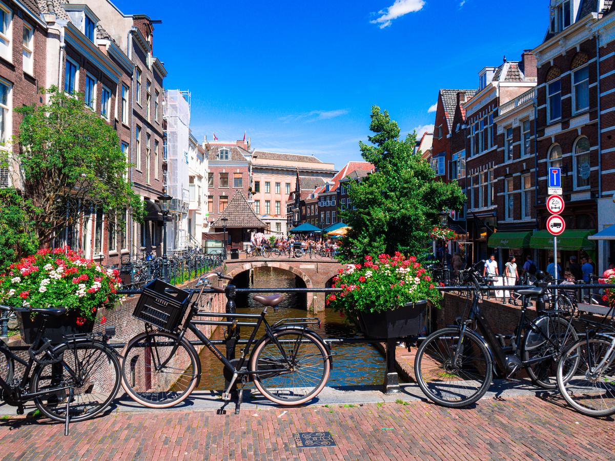 Historic Binnenstad district, Utrecht canal view with bicycles and bridge