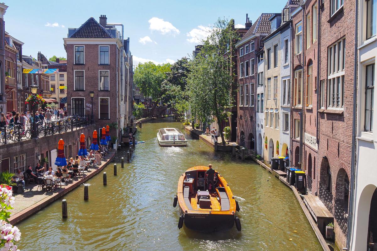 Scenic Utrecht canal with boat tour and dining