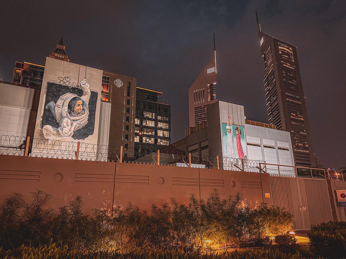 Dubai street art and modern architecture at night
