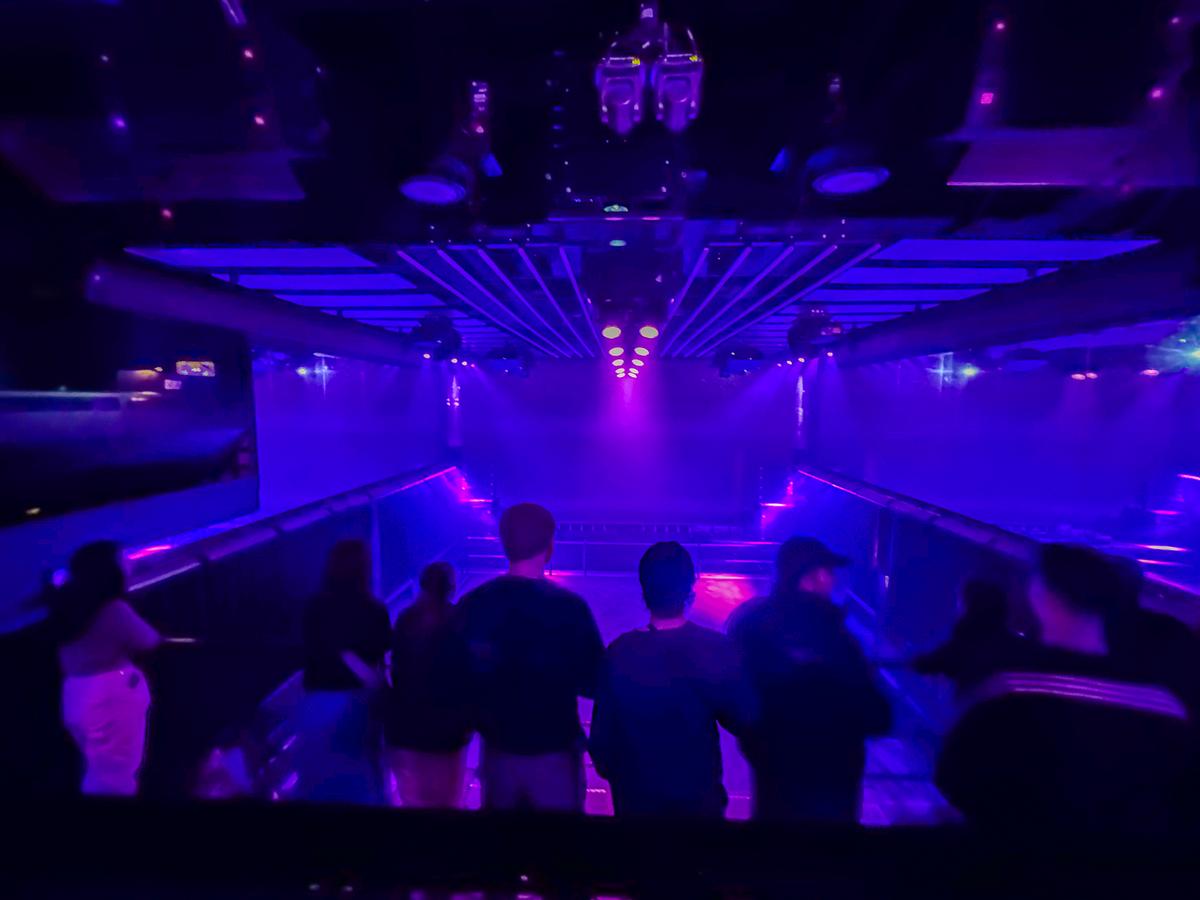 Nightlife scene at Club Air, Amsterdam with energetic crowd and dynamic lights.